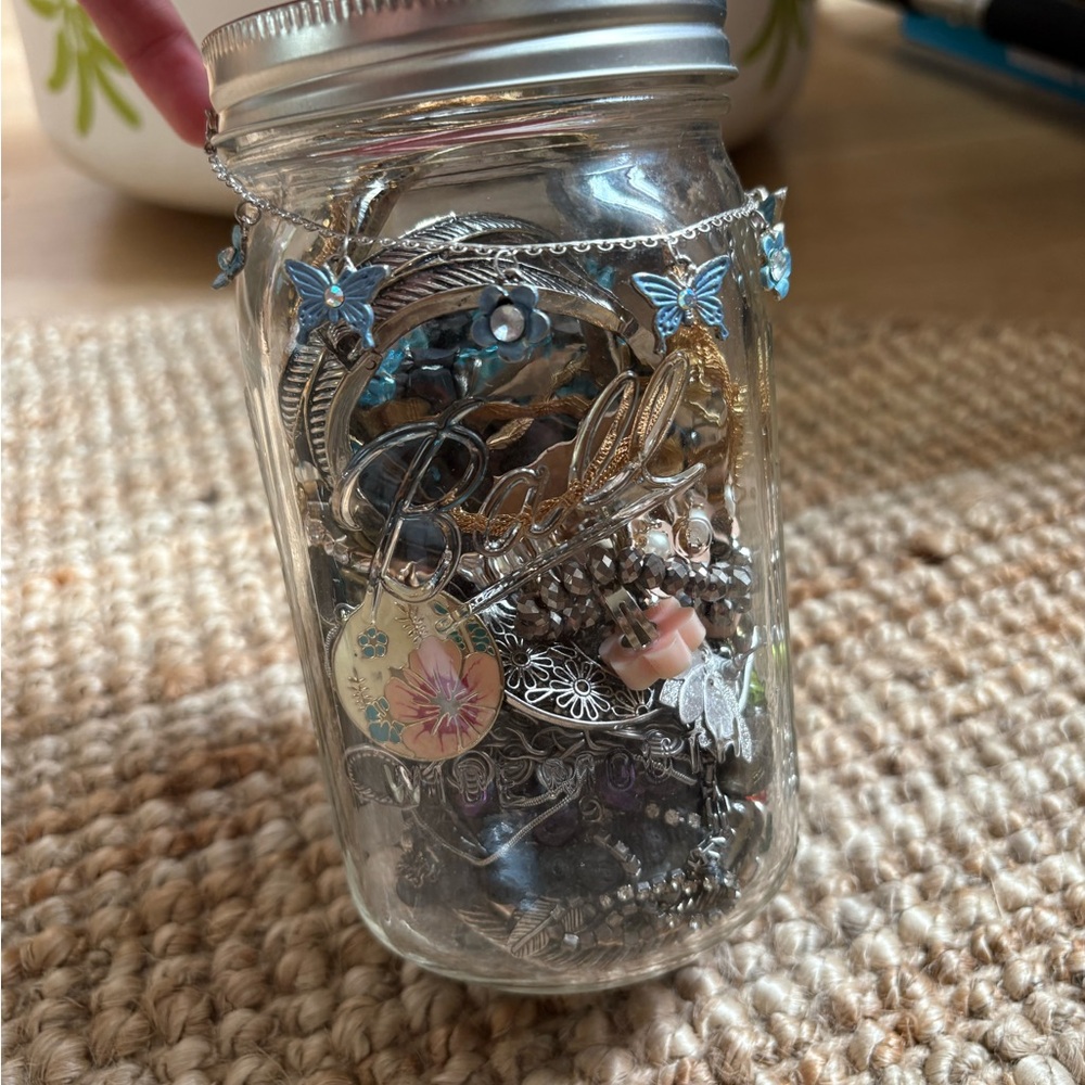 Flower and butterfly themed vintage jewelry jar